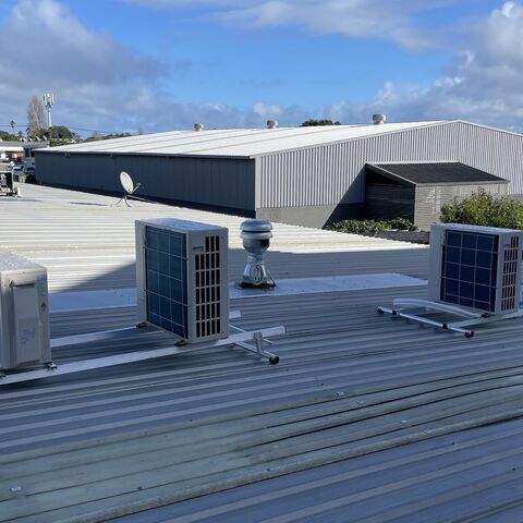 Job photo 1: three heat pump outdoor units on a roof