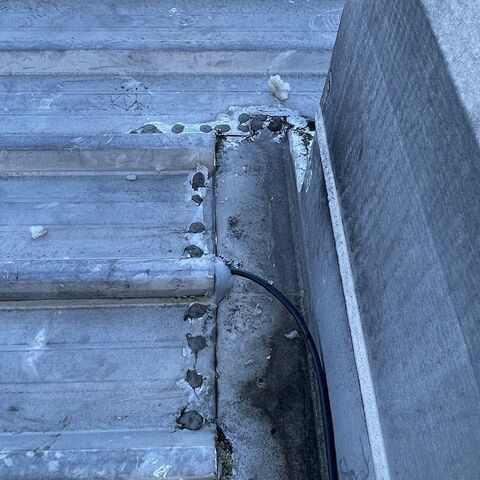 Job photo 2: a cable run in conduit along a roof parapet