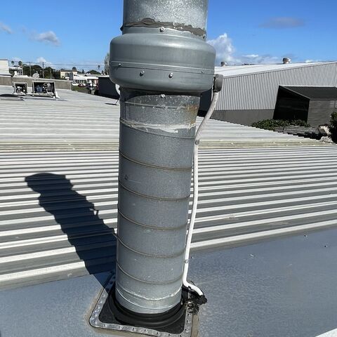 Job photo 3: cable in conduit passing clear of a roof flue